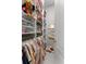 Organized closet with shelving and hanging rods, ideal for maximizing storage space at 8614 Hata St, Orlando, FL 32827