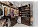 Walk-in closet with custom shelving and storage for clothes, shoes, and accessories at 8614 Hata St, Orlando, FL 32827