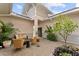 Relaxing courtyard with ample seating, decorative plants, and charming string lights overhead at 8614 Hata St, Orlando, FL 32827