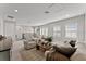 Bright living room with a staircase, comfortable seating, and an open floor plan at 8614 Hata St, Orlando, FL 32827