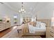Bright main bedroom features hardwood floors, a seating area, and a large decorative rug at 8614 Hata St, Orlando, FL 32827