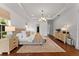 Spacious main bedroom with a decorative chandelier and a large window for natural light at 8614 Hata St, Orlando, FL 32827