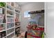 Organized storage room with ample shelving and clear containers for easy access at 8614 Hata St, Orlando, FL 32827