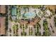 Overhead aerial shot features lazy river and a resort-style pool surrounded by a vast residential area at 8879 Geneve Ct, Kissimmee, FL 34747