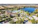 An aerial view of the community pool area, including the pool, water slides, and lounge chairs for residents at 8879 Geneve Ct, Kissimmee, FL 34747
