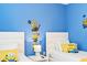 Delightful ' bedroom featuring twin beds and playful Minion-themed decorations for a fun atmosphere at 8879 Geneve Ct, Kissimmee, FL 34747