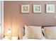Bedroom with a neutral color scheme and decorative sand dollar artwork at 8879 Geneve Ct, Kissimmee, FL 34747