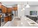 Spacious kitchen island with stainless steel appliances, and breakfast bar at 8879 Geneve Ct, Kissimmee, FL 34747