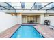 A private pool with a brick-lined patio creates a relaxing outdoor living space at 8879 Geneve Ct, Kissimmee, FL 34747