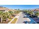 Street view with well-maintained lawns, palm trees, and sidewalks lining the street at 8879 Geneve Ct, Kissimmee, FL 34747