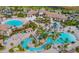 Aerial view of community featuring multiple pools, including a lazy river and a resort style pool, plus a clubhouse at 8924 Azalea Sands Ln # 8924, Davenport, FL 33896
