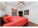 Cozy bedroom with laminate flooring, a ceiling fan, and natural light from the window at 8924 Azalea Sands Ln # 8924, Davenport, FL 33896