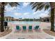 A large, luxurious community pool area surrounded by lounge chairs and palm trees at 8924 Azalea Sands Ln # 8924, Davenport, FL 33896