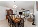 Elegant dining room featuring a large table set for a meal, adjacent to the living room at 8924 Azalea Sands Ln # 8924, Davenport, FL 33896