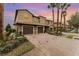 Townhome exterior featuring a brick driveway and a two-car garage at 8924 Azalea Sands Ln # 8924, Davenport, FL 33896