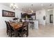 Open-concept kitchen with dark cabinets, stainless steel appliances, and a breakfast bar at 8924 Azalea Sands Ln # 8924, Davenport, FL 33896