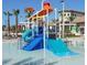 Community waterpark featuring colorful waterslide, shallow pool, and water bucket splash zone for Gathering fun at 8924 Azalea Sands Ln # 8924, Davenport, FL 33896