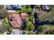 Overhead view of estate showcasing private dock, backyard oasis, and luxurious pool in a serene, leafy neighborhood at 9212 Island Lake Ct, Orlando, FL 32836