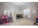 This cheerful bedroom has a leaf-themed wallpaper, a chandelier and a bunk bed with stairs at 9212 Island Lake Ct, Orlando, FL 32836
