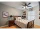 Cozy bedroom with natural light, bedside tables, a ceiling fan, niche shelving, and decor accents at 9212 Island Lake Ct, Orlando, FL 32836