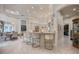 Modern kitchen featuring a marble countertop island with bar seating, stainless steel appliances, and a breakfast nook at 9212 Island Lake Ct, Orlando, FL 32836