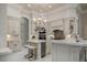 Gourmet kitchen features marble countertops, stainless steel appliances, and a stylish chandelier at 9212 Island Lake Ct, Orlando, FL 32836