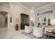 Bright and airy living space with soaring ceilings, marble floors, and French doors leading to an outdoor patio at 9212 Island Lake Ct, Orlando, FL 32836