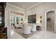 Spacious living room with soaring ceilings, elegant decor, and French doors leading to an outdoor area at 9212 Island Lake Ct, Orlando, FL 32836