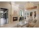 Bright living room with marble floors, fireplace, and access to the outdoor patio, perfect for relaxing at 9212 Island Lake Ct, Orlando, FL 32836