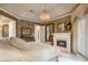 Spacious main bedroom features a fireplace, ensuite bathroom, and a private balcony, perfect for relaxation at 9212 Island Lake Ct, Orlando, FL 32836