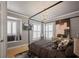 This cozy main bedroom features a four-poster bed, decorative pillows, and natural light from shuttered windows at 9212 Island Lake Ct, Orlando, FL 32836