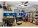 Bedroom featuring a ceiling fan, gaming computers, and shelving units displaying various collectibles at 105 Morning Glory Dr, Lake Mary, FL 32746