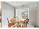 Cozy breakfast nook featuring a wooden table with four chairs and natural light at 105 Morning Glory Dr, Lake Mary, FL 32746