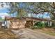 Inviting single-Gathering home with a two-car garage and lush front yard foliage at 105 Morning Glory Dr, Lake Mary, FL 32746