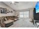 Cozy living room with plush sectional sofa and sliding glass doors at 105 Morning Glory Dr, Lake Mary, FL 32746