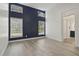 Spacious main bedroom with a decorative accent wall and lots of natural light at 10525 Satinwood Cir, Orlando, FL 32825