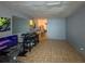 Spacious basement area with gray walls and vintage tile flooring and mirror at 1067 Lyric Dr, Deltona, FL 32738