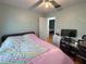 Comfortable bedroom with a ceiling fan, closet, and neutral paint at 1067 Lyric Dr, Deltona, FL 32738