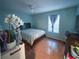 Bright bedroom with a window, closet, and neutral paint at 1067 Lyric Dr, Deltona, FL 32738