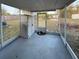 Screened patio features concrete flooring and outdoor storage at 1067 Lyric Dr, Deltona, FL 32738