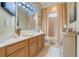 Bathroom featuring double vanity, framed mirror and a shower at 10819 Woodchase Circle, Orlando, FL 32836