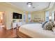 Bright main bedroom with wood floors, and sitting area at 10819 Woodchase Circle, Orlando, FL 32836