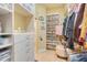 Walk-in closet with custom shelving, shoe storage and ample space for organization at 10819 Woodchase Circle, Orlando, FL 32836