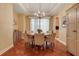 Cozy dining room with a round table, stylish chairs, and elegant chandelier at 10819 Woodchase Circle, Orlando, FL 32836