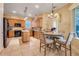 Functional kitchen featuring a breakfast nook, tile backsplash, and black appliances at 10819 Woodchase Circle, Orlando, FL 32836