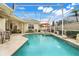 Enclosed pool featuring a hot tub, comfortable seating and lots of room for lounging at 10819 Woodchase Circle, Orlando, FL 32836