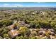 An aerial view of a neighborhood surrounded by beautiful green trees at 111 Autumn Dr, Longwood, FL 32779