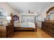 Comfortable bedroom showcasing wood floors, a decorative ceiling fan, and shuttered windows at 111 Autumn Dr, Longwood, FL 32779