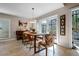 Bright dining area featuring a table with unique chairs and access to the outdoor space at 111 Autumn Dr, Longwood, FL 32779