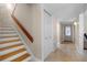 Entryway with stairs leading to a second floor, closet, and tiled entryway flooring at 111 Autumn Dr, Longwood, FL 32779